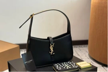 Black purse with gold lettering