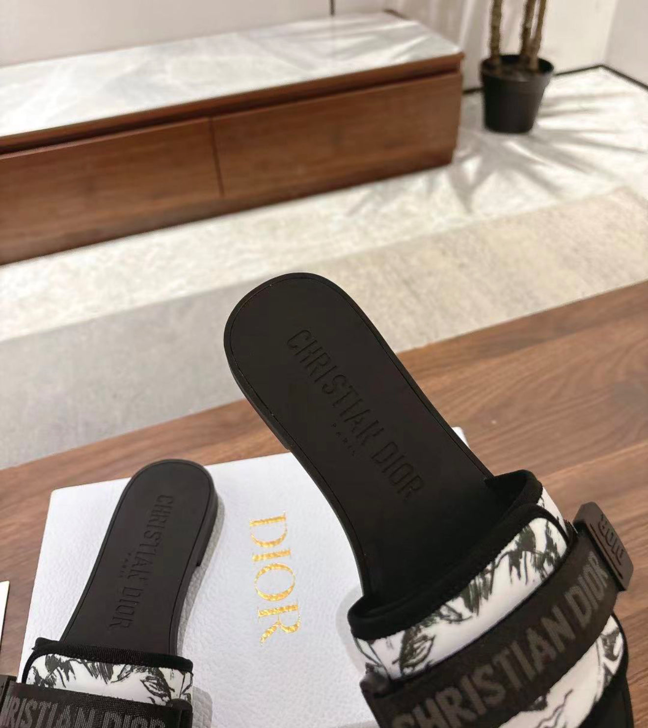 Woman’s slides with box