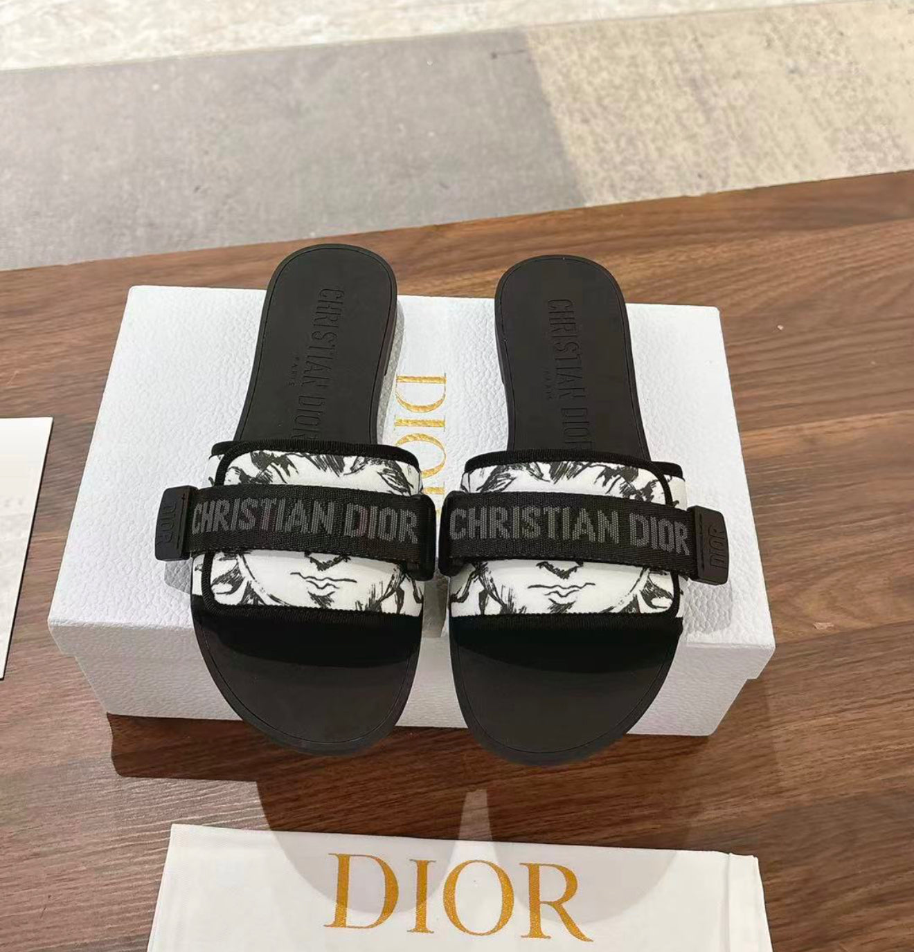 Woman’s slides with box