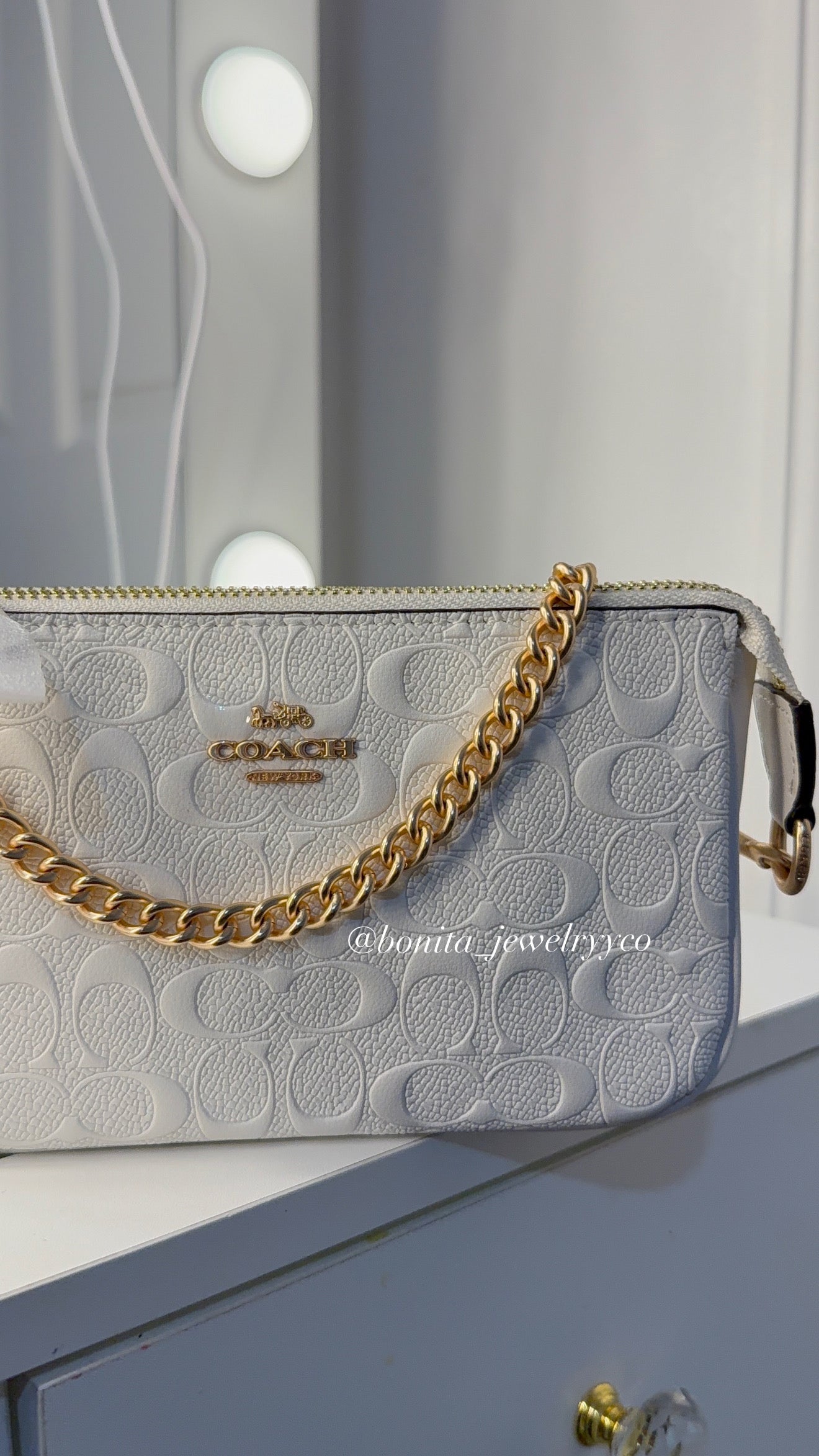 White bag with rose gold straps