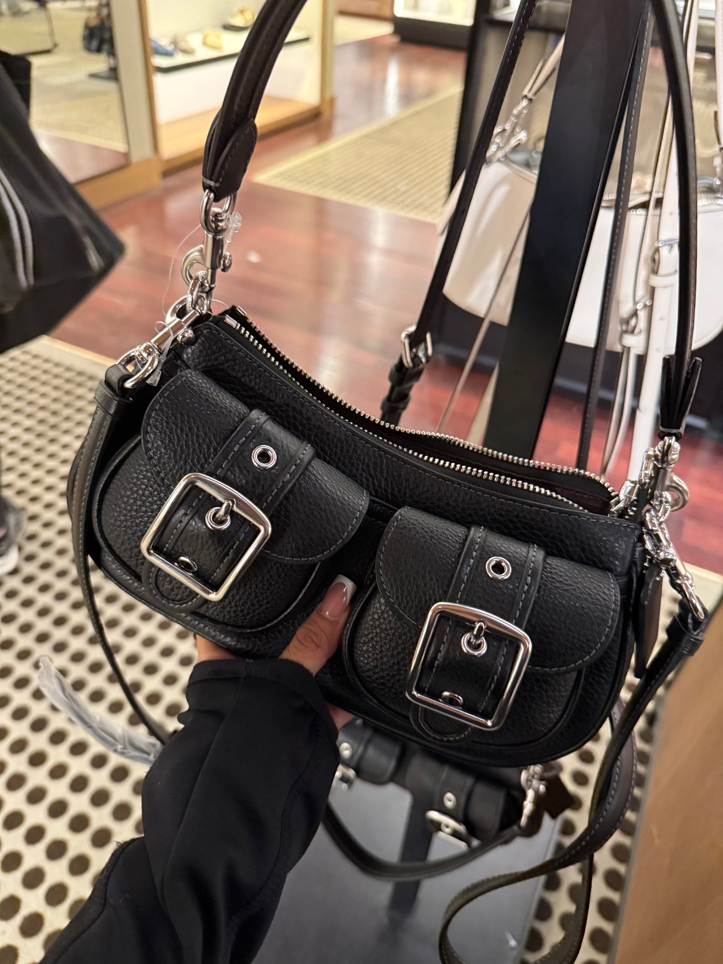 Black purse with cross body strap