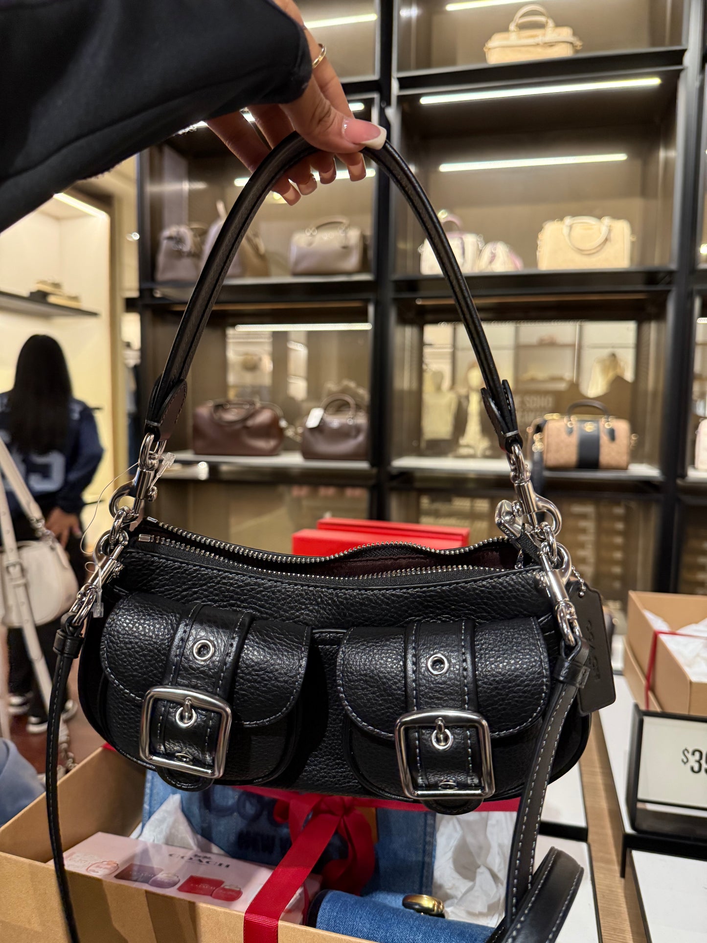 Black purse with cross body strap