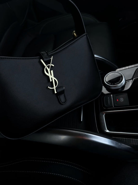 Black purse with gold lettering
