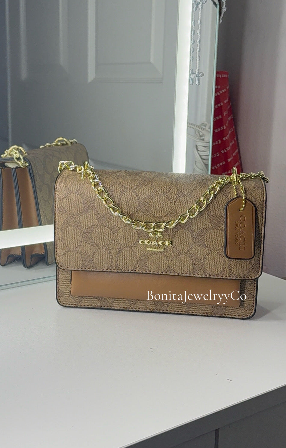 Brown purse with gold strap