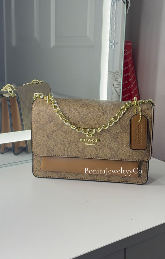 Brown purse with gold strap