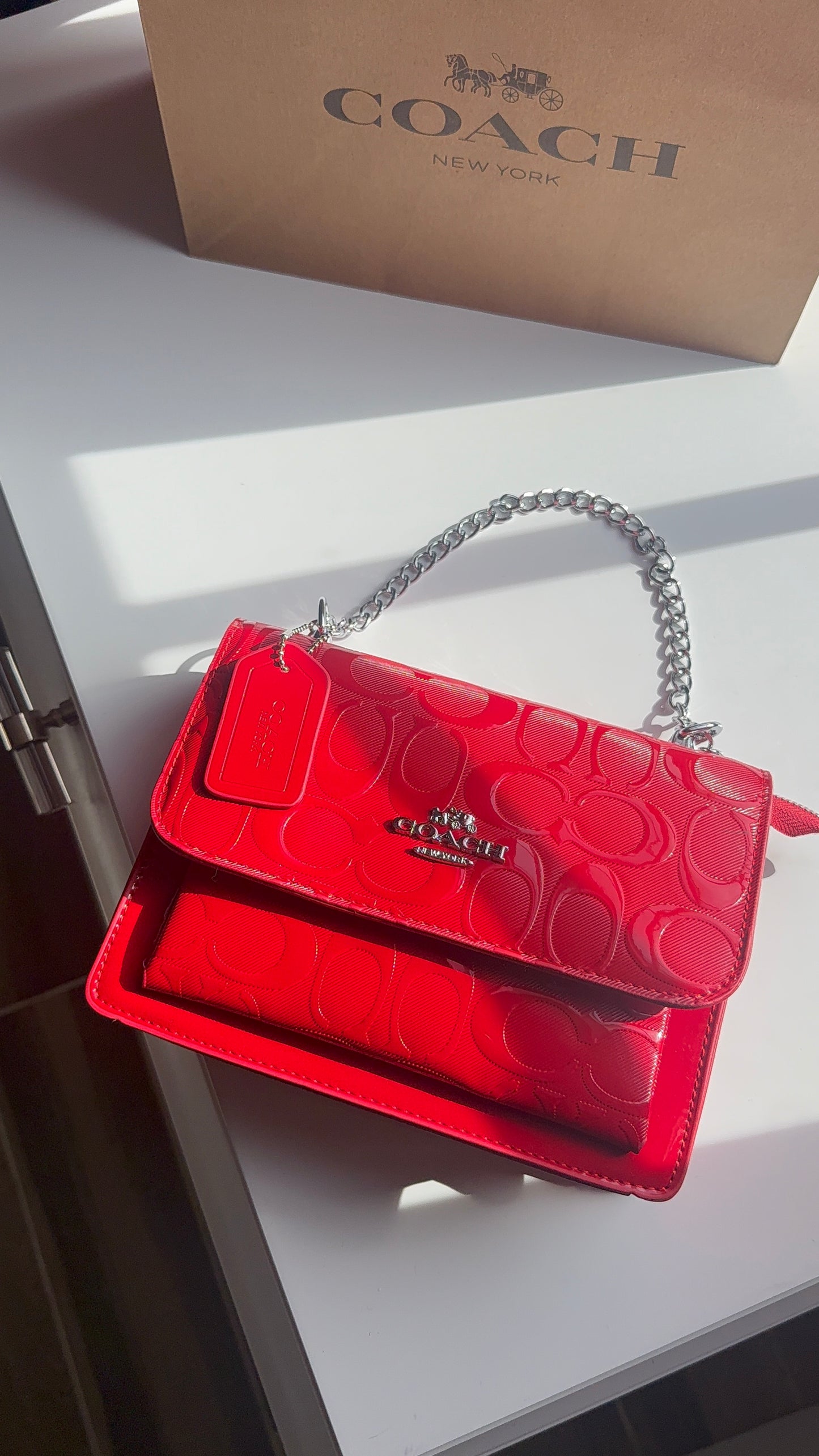 Red purse with silver straps