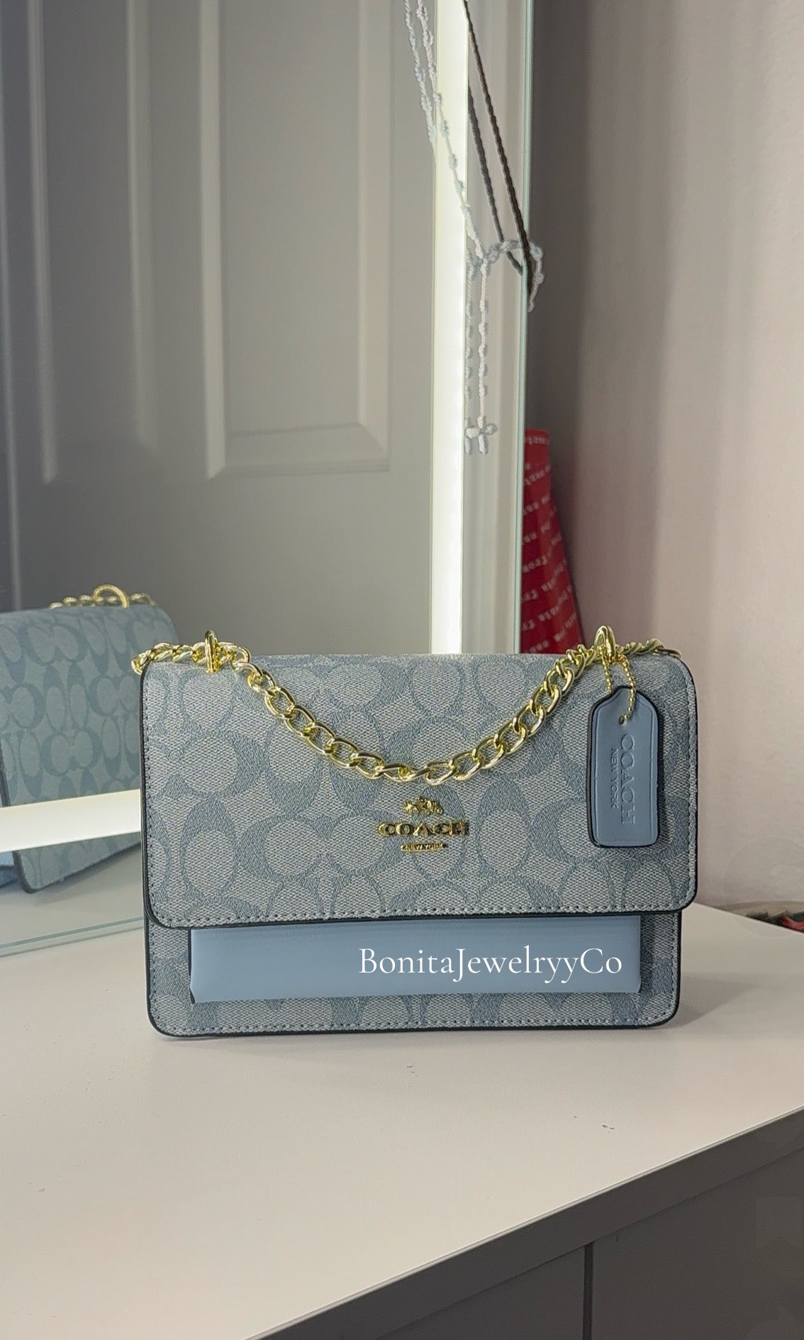 Blue purse with gold strap