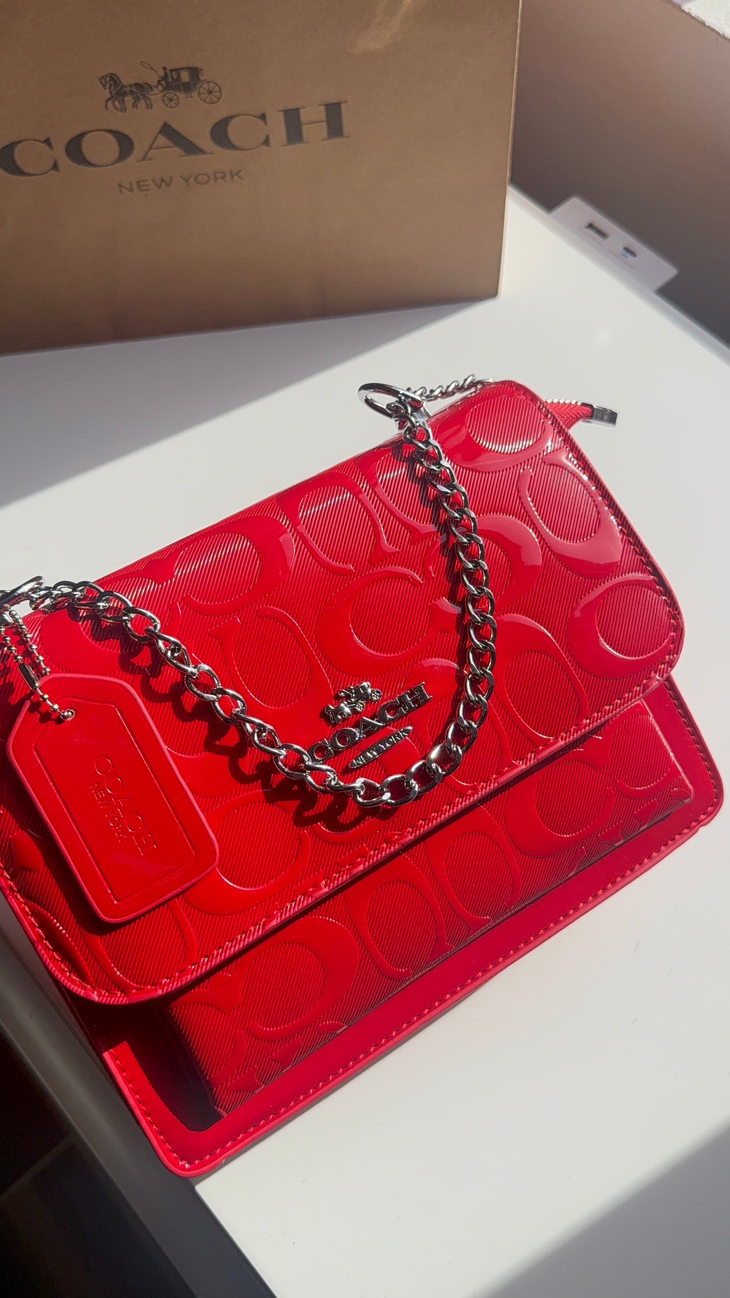 Red purse with silver straps