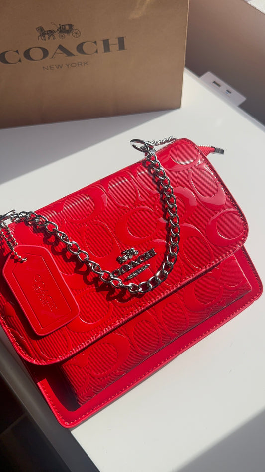 Red purse with silver straps