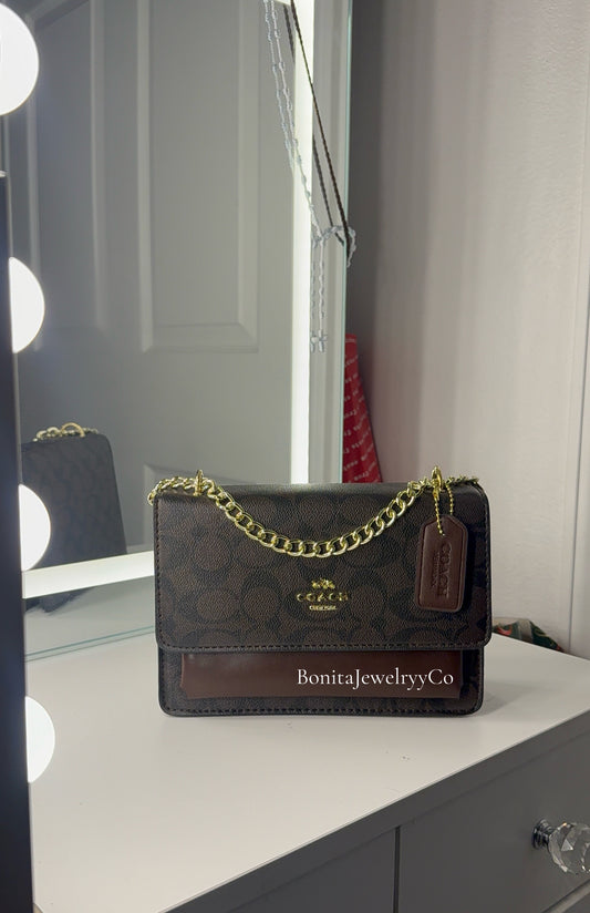 Dark brown purse with gold strap
