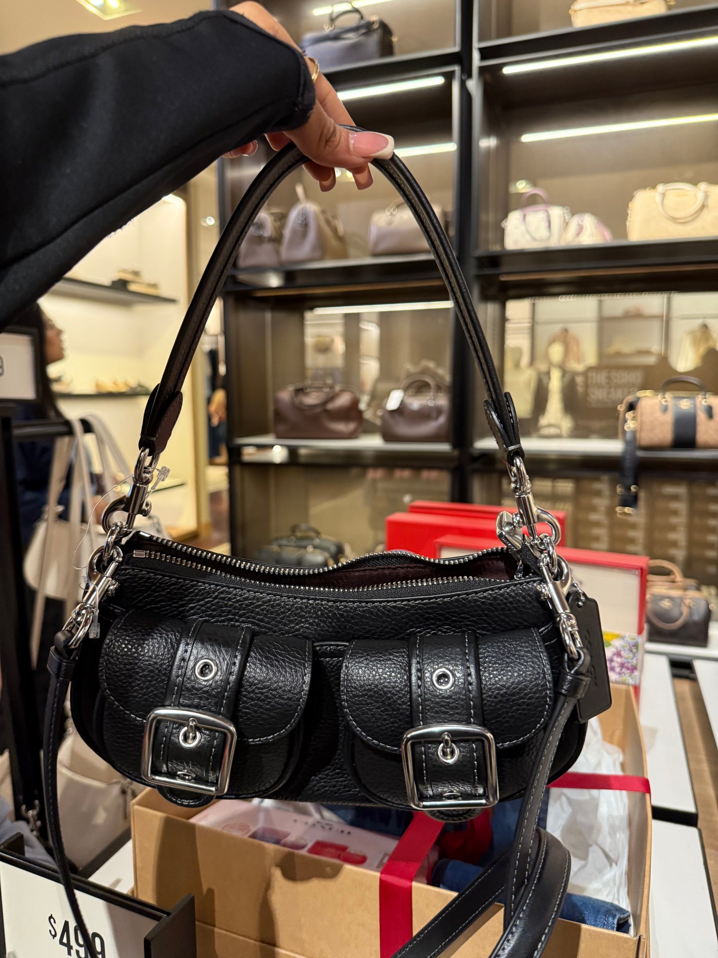 Black purse with cross body strap